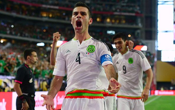 Mexico center back Rafa Marquez (#4, front) celebrates after scoring the game-winning goal in Mexico's 3-1 win over Uruguay. Photo credit: Jennifer Stewart/Getty Images Sport