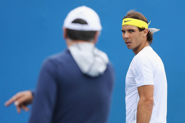 Rafael Nadal (facing) takes direction from Toni Nadal during a practice. Photo: Michael Dodge/Getty Images