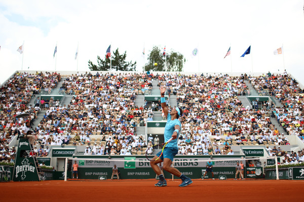 Nadal serves in front of the Suzanne Lenglen crowd (Getty/Cameron Spencer)