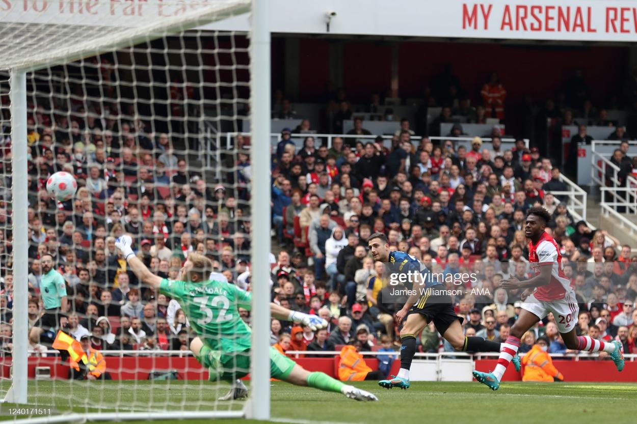 LONDON, ENGLAND - APRIL 23: Diogo Dalot of <strong><a  data-cke-saved-href='https://www.vavel.com/en/football/2022/04/21/arsenal/1109205-the-warmdown-arsenal-back-to-winning-ways-at-stamford-bridge.html' href='https://www.vavel.com/en/football/2022/04/21/arsenal/1109205-the-warmdown-arsenal-back-to-winning-ways-at-stamford-bridge.html'>Manchester United</a></strong> has a shot during the <strong><a href='https://www.vavel.com/en/football/2022/04/14/arsenal/1108421-mikel-arteta-faced-with-selection-headache-ahead-of-trip-to-the-south-coast.html'>Premier League</a></strong> match between Arsenal and <strong><a  data-cke-saved-href='https://www.vavel.com/en/football/2022/04/21/arsenal/1109205-the-warmdown-arsenal-back-to-winning-ways-at-stamford-bridge.html' href='https://www.vavel.com/en/football/2022/04/21/arsenal/1109205-the-warmdown-arsenal-back-to-winning-ways-at-stamford-bridge.html'>Manchester United</a></strong> at Emirates Stadium on April 23, 2022 in London, United Kingdom. (Photo by James Williamson - AMA/Getty Images)