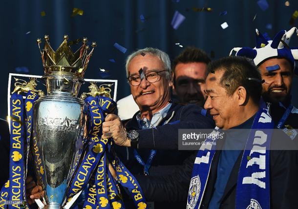 Claudio Ranieri showcases the Premier League trophy to Leicester fans during the club's open-top bus parade in 2016. Source - Getty Images.