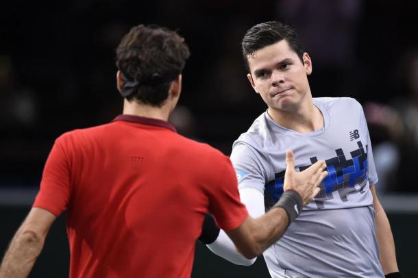 Raonic (right) shakes hands after beating Roger Federer (left) in 2014. Photo: Frank Fife/AFP