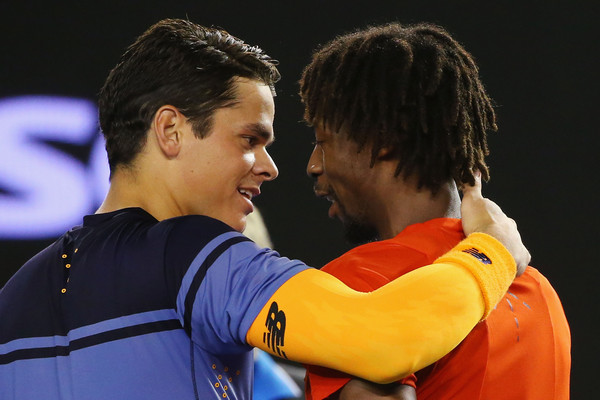 Raonic (left) and Monfils embrace at the net after Raonic's victory. Photo: Michael Dodge/Getty Images
