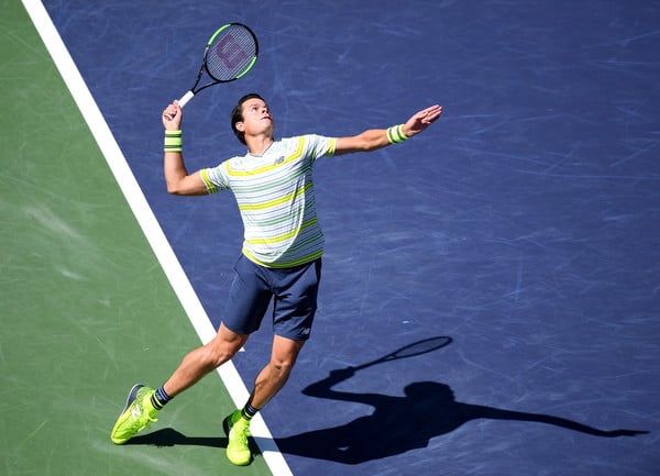 Raonic fires one of his clutch serves during the quarterfinal win. The Canadian's big serve bailed him out in the final set. Photo: Harry How/Getty Images