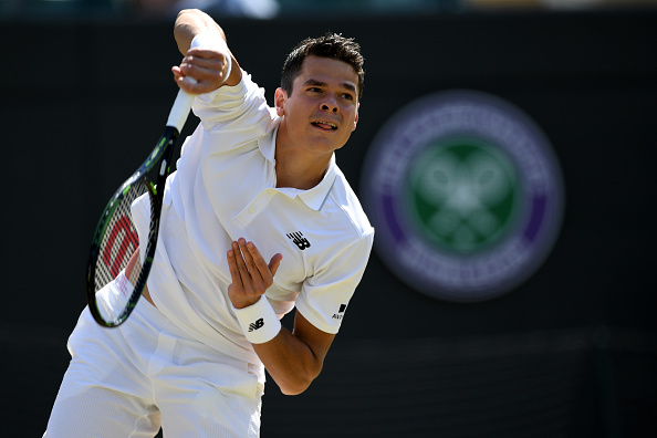 Raonic hits a serve during his quarterfinal win. PhotoL Shaun Botterill/Getty Images