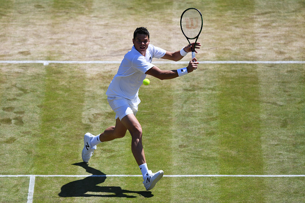 Raonic reaches for a volley on Wednesday at Wimbledon. Photo: Shaun Botterill/Getty Images