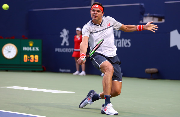 Milos Raonic slides into a backhand on Centre Court in Toronto. Photo: Getty Images