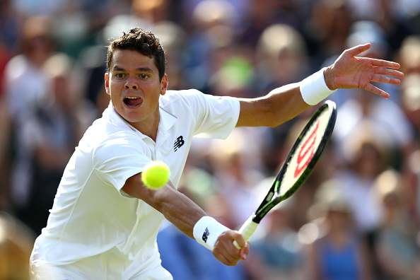 Raonic lunges for a backhand on day one at Wimbledon. Photo: Julian Finney/Getty Images