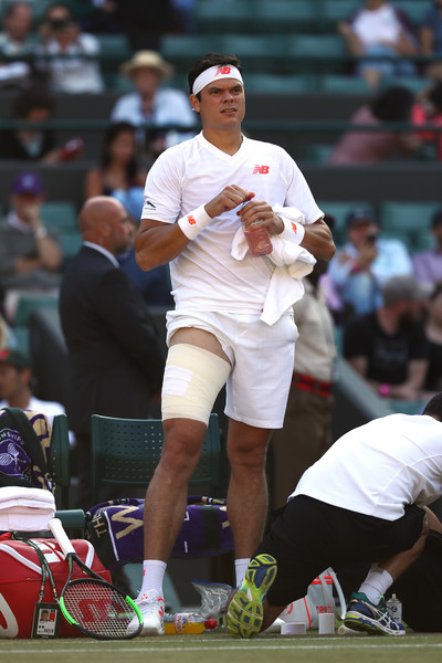 Raonic gets his leg taped during Wimbledon. He tore his quadricep during the match. Photo: Michael Steele/Getty Images