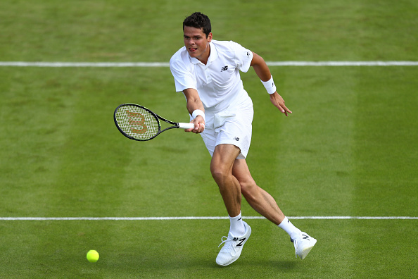 Raonic hits a forehand volley during his first round match. Photo: Julian Finney/Getty Images