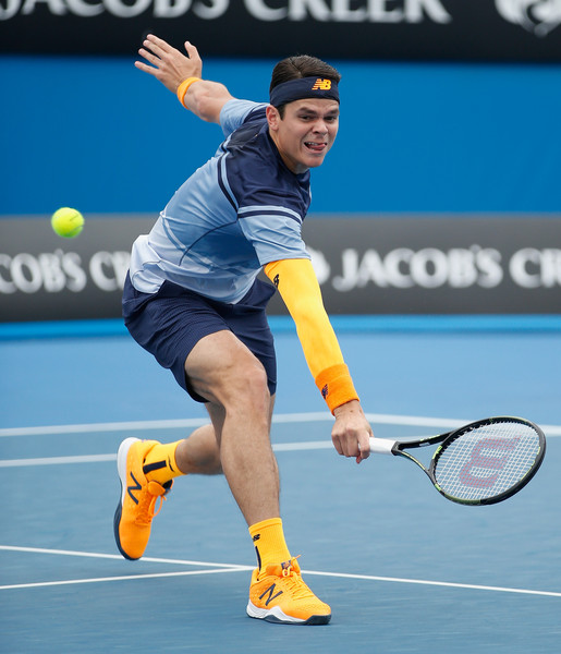 Milos Raonic hits a volley, something he tried to do a lot of Thursday. Photo: Darrian Traynor/Getty Images