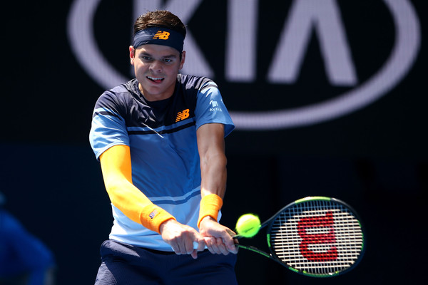 Raonic hits a backhand in his fourth round match. (Photo: Mark Kolbe/Getty Images)