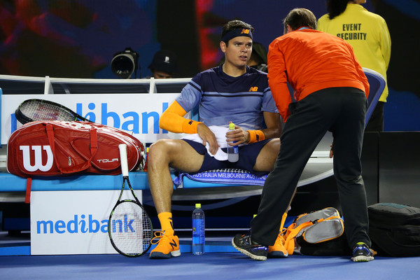 Milos Raonic speaks to the trainer during the fourth set of his semifinal. Photo: Michael Dodge/Getty Images