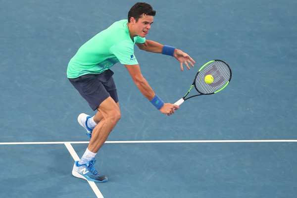Raonic hits a backhand volley during his second round win in Brisbane. Photo: Chris Hyde/Getty Images