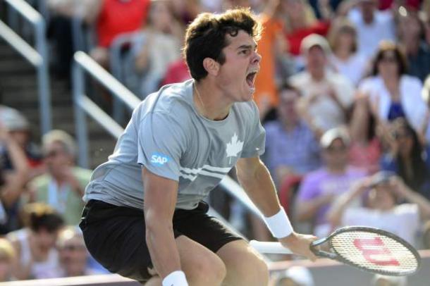 Milos Raonic leaps into the air after winning his 2013 semifinal in Montreal. Photo: Paul Chiasson/The Canadian Press