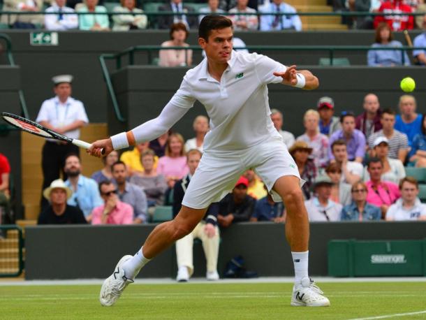 Raonic moves in towards the net during a match at Wimbledon in 2014. Photo: AFP