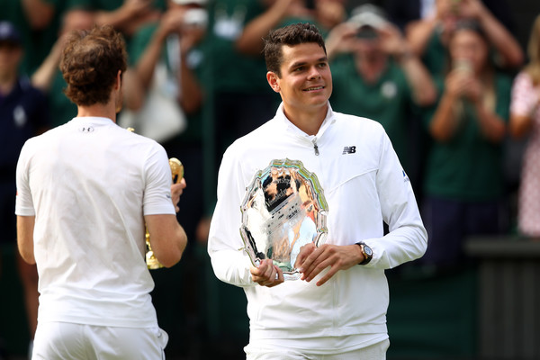 Raonic poses with his runner-up trophy at Wimbledon. Photo: Clive Brunskill/Getty Images