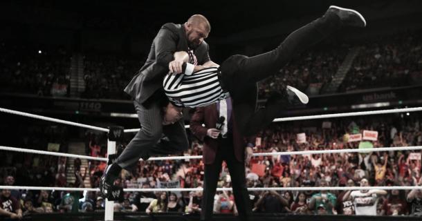 Triple H performing a pedigree to a referee (image: therichest.com)