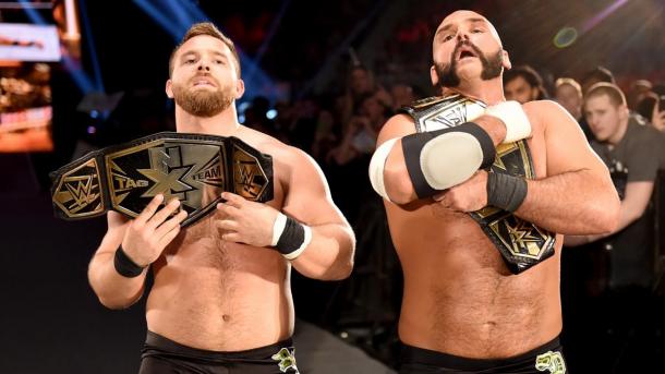 "No fists just flips," the champs retain. Photo: WWE.com