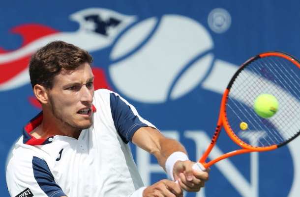 Photo: Richard Heathcote/Getty Images: Carreno Busta hits a forehand return down the line.