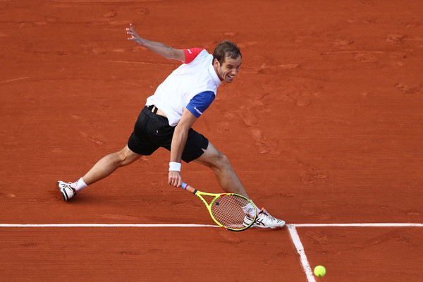 Richard Gasquet of France plays a backhand during the Men's Singles first round match against Thomaz Bellucci of Brazil on day two of the 2016 French Open at Roland Garros on May 23, 2016 in Paris, France. (Photo by Julian Finney/Getty Images Europe)