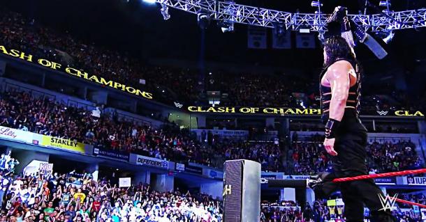 Roman Reigns holds his US Title (image: wwe network)
