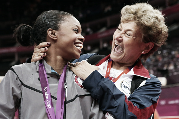 Marta Karolyi celebrating a gold medal with Gabby Douglas in London. Photo Credit: Ronald Martinez of Getty Images