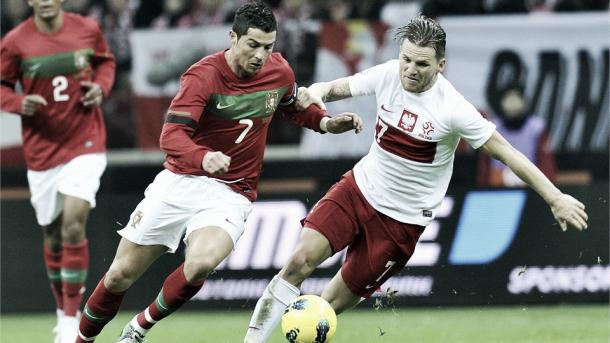 Above: Cristiano Ronaldo battling with Damien Perquis in Poland's 0-0 draw with Portugal back in 2012 | Photo: fifa.com