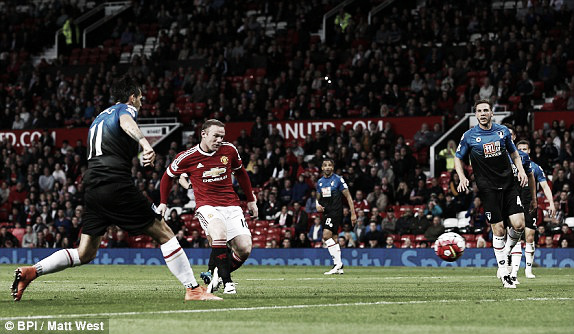 Above: Manchester United captain Wayne Rooney strikes home his 100th league goal at Old Trafford in their 3-1 win over AFC Bournemouth | Photo: BPI / Matt West 