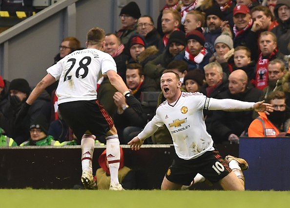 Wayne Rooney celebrates with Morgan Schneiderlin at Anfield | Photo: John Powell/Liverpool FC