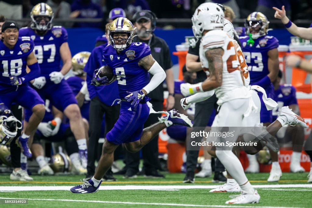 Washington wide receiver Ja'Lynn Polk (2) glances at a defender after bringing in a catch during the All State Sugar Bowl playoff game between the Texas Longhorns and the Washington Huskies on Monday, January 1, 2024 at Caesars Superdome in New Orleans, LA. (Photo by Nick Tre. Smith/Icon Sportswire via Getty Images)