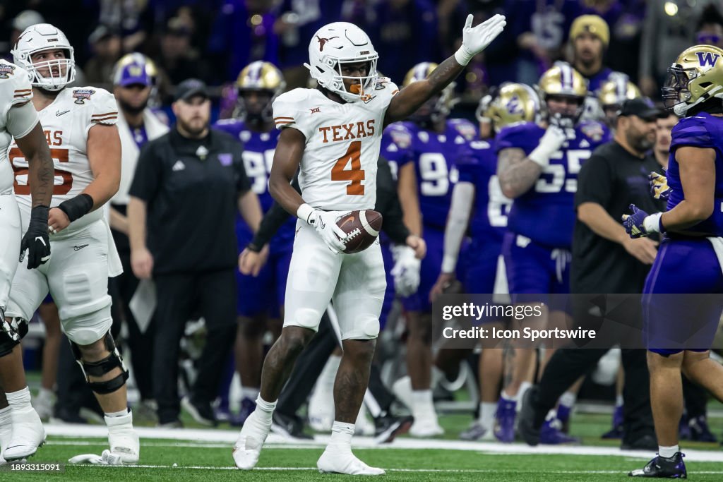 Texas running back CJ Baxter (4) signals for a first down after a run during the All State Sugar Bowl playoff game between the Texas Longhorns and the Washington Huskies on Monday, January 1, 2024 at Caesars Superdome in New Orleans, LA. (Photo by Nick Tre. Smith/Icon Sportswire via Getty Images)