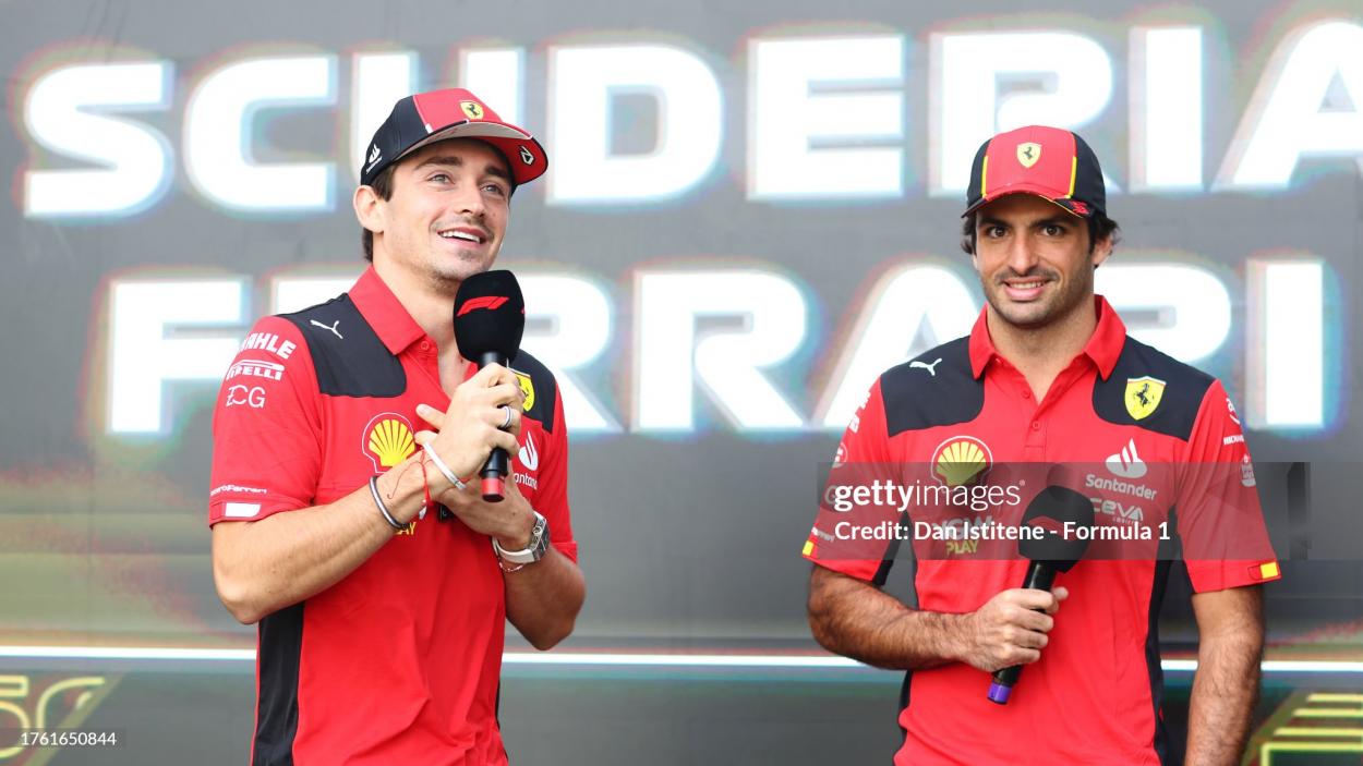 Charles Leclerc of Monaco and Ferrari and Carlos Sainz of Spain and Ferrari talk to the crowd on the fan stage prior to final practice ahead of the F1 Grand Prix of Mexico at Autodromo Hermanos Rodriguez on October 28, 2023 in Mexico City, Mexico. (Photo by Dan Istitene - Formula 1/Formula 1 via Getty Images)