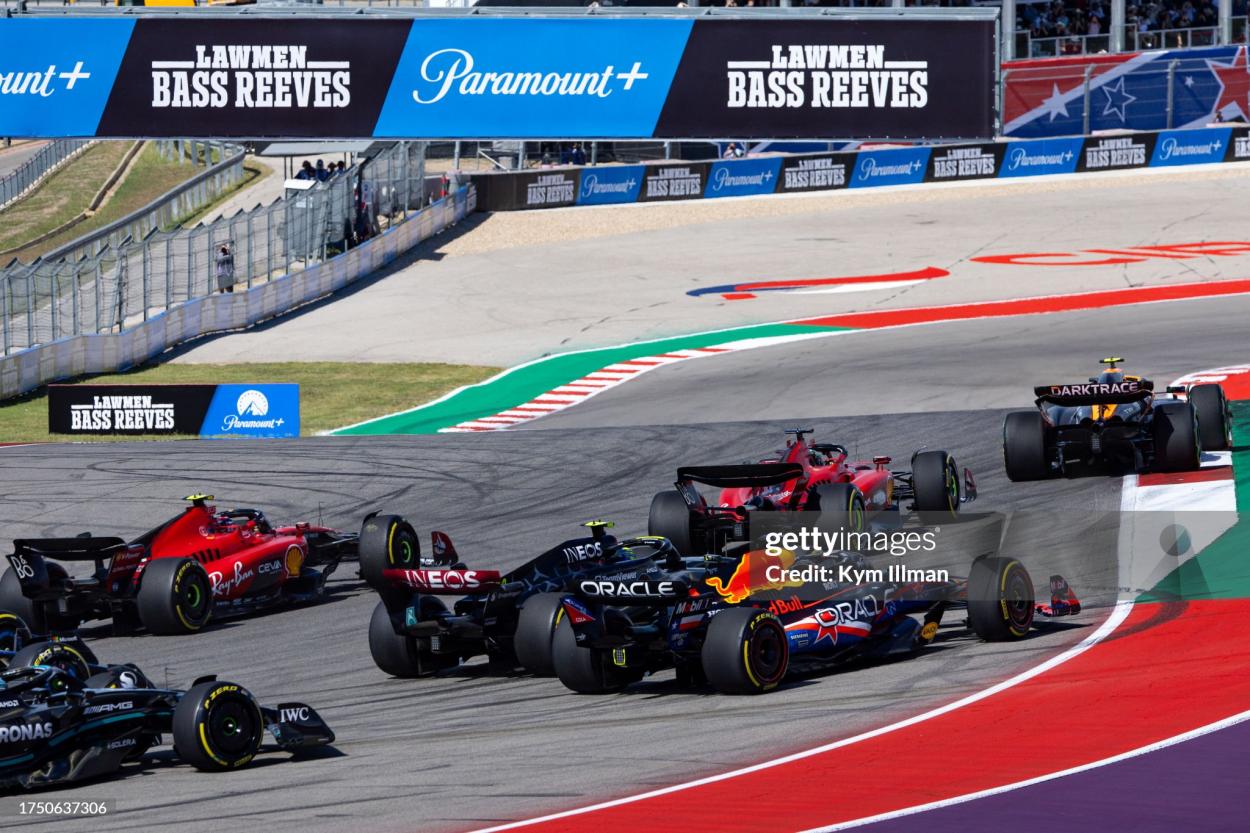 Lando Norris of Great Britain and McLaren leads from Charles Leclerc of Monaco and Ferrari F1 team on the first lap of the F1 Grand Prix of United States at Circuit of The Americas on October 22, 2023 in Austin, Texas. (Photo by Kym Illman/Getty Images)