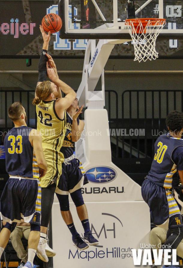 Drake LaMont (42) takes the left handed hook shot over Jon Hovermale (4). Photo: Walter Cronk