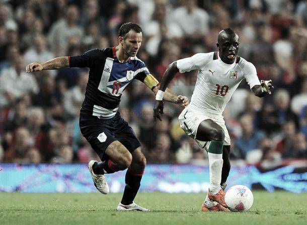 Mane battles for possession with Great Britain's Ryan Giggs in 2012 (image:propaganda.photoshelter.com)