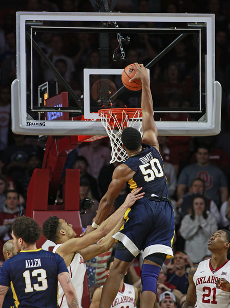 Konate throws down a dunk during last night's game in Norman/Photo: Brett Deering/Getty Images