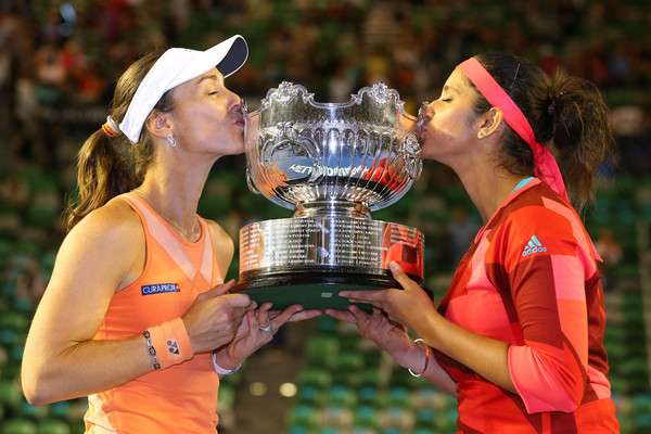 Hingis (left) and Mirza kiss their Australian Open trophy in January. Photo: Scott Barbour/Getty Images