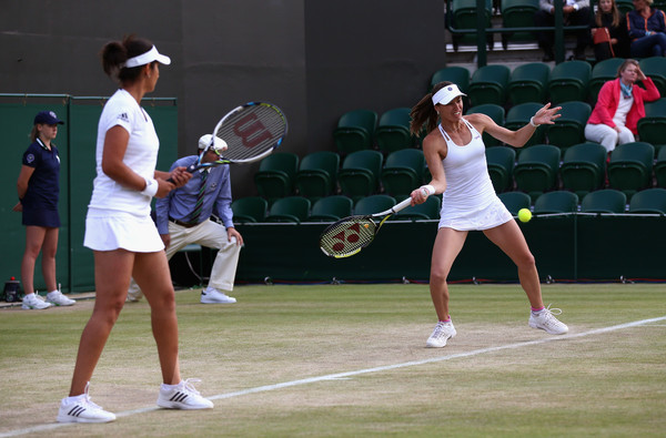 Hingis (right) hits a forehand as Mirza watches last year at Wimbledon. Photo: Carl Court/Getty Images