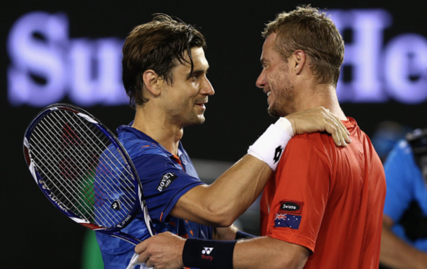 Ferrer and Hewitt share a touching moment at the net after the Spaniard ended the Australian's career in front of his home fans at Rod Laver Arena. Cameron Spencer/Getty Images
