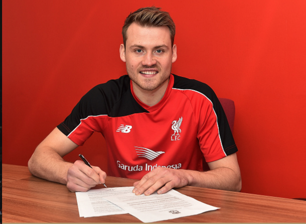 Mignolet puts pen-to-paper on his new deal. (Picture: Getty Images)