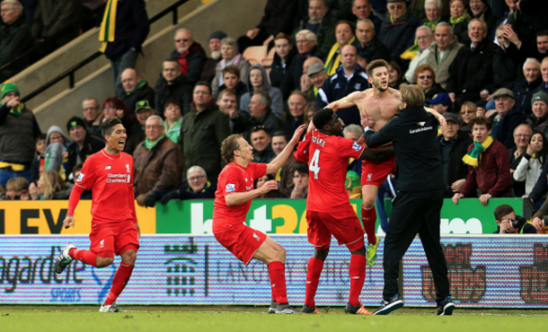 Lallana jubilantly leaps into his manager's arms after making it 5-4. (Picture: Getty Images)