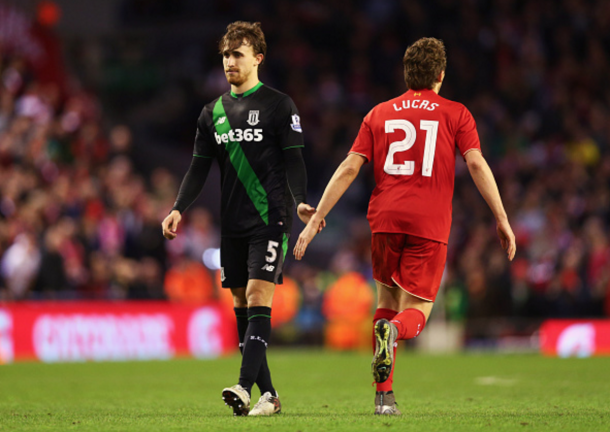 Lucas shakes hands with Marc Muniesa before the defender missed in sudden death. (Picture: Getty Images)