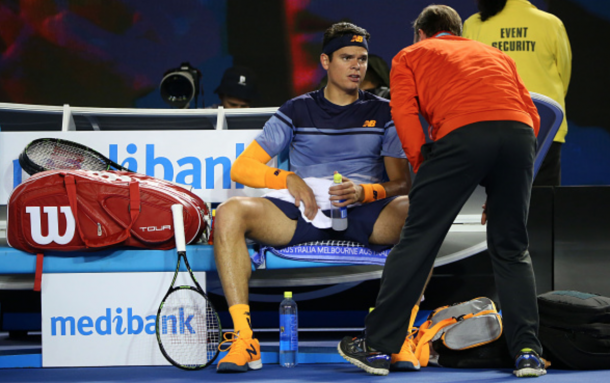 Milos Raonic of Canada recieves medical attention in his semi final match against Andy Murray of Great Britain during day 12 of the 2016 Australian Open at Melbourne Park on January 29, 2016 in Melbourne, Australia. (Photo by Michael Dodge/Getty Images)