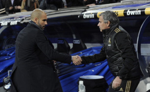 Barcelona's coach Josep Guardiola (L) and Real Madrid's coach Jose Mourinho shake hand before the Spanish Cup 'El clasico' football match Real Madrid - Barcelona at the Santiago Bernabeu stadium in Madrid on January 18, 2011. AFP PHOTO/ DANI POZO (Photo credit should read DANI POZO/AFP/Getty Images)