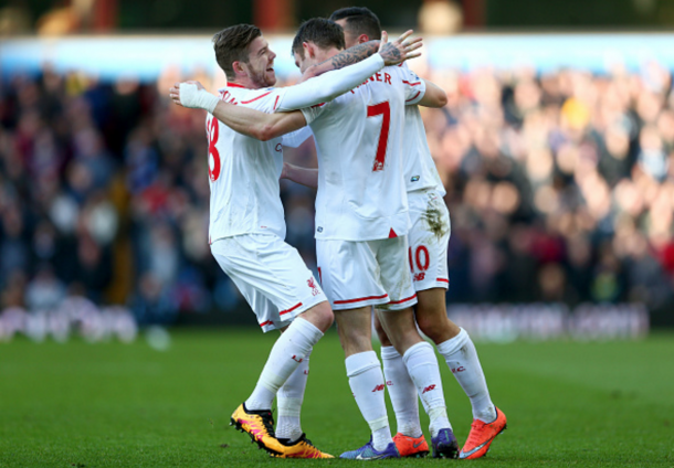 Milner celebrates with two of his teammates after doubling Liverpool's lead in the first-half. (Picture: Getty Images)