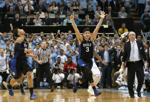 Grayson Allen and Derrick Thornton run off jubilated while Roy Williams looks on as Duke stuns Carolina in Chapel Hill. Streeter Lacka/Getty Images