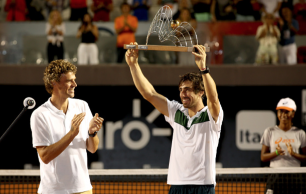 Gustavo Kuerten of Brazil watches as Pablo Cuevas of Uraguay celebrates his win over Guido Pella of Argentina during the final of the Rio Open at Jockey Club Brasileiro on February 21, 2016 in Rio de Janeiro, Brazil. (Photo by Matthew Stockman/Getty Images)