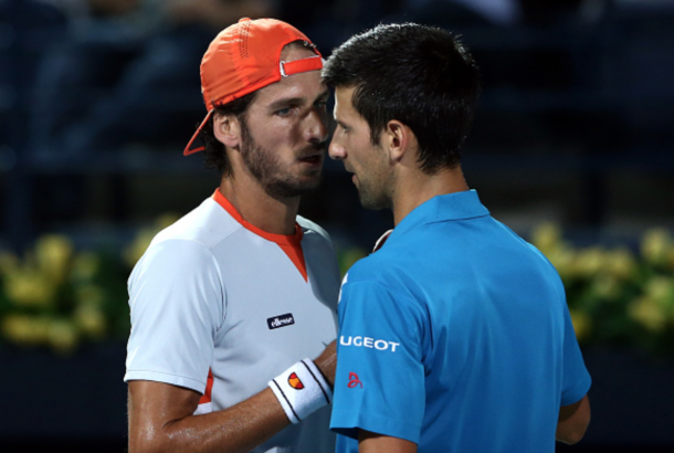 Novak Djokovic of Serbia shakes hands with Feliciano Lopez of Spain as he withdraws from his quarter final match on day six of the ATP Dubai Duty Free Tennis Championship at the Dubai Duty Free Stadium on February 25, 2016 in Dubai, United Arab Emirates. (Photo by Warren Little/Getty Images)