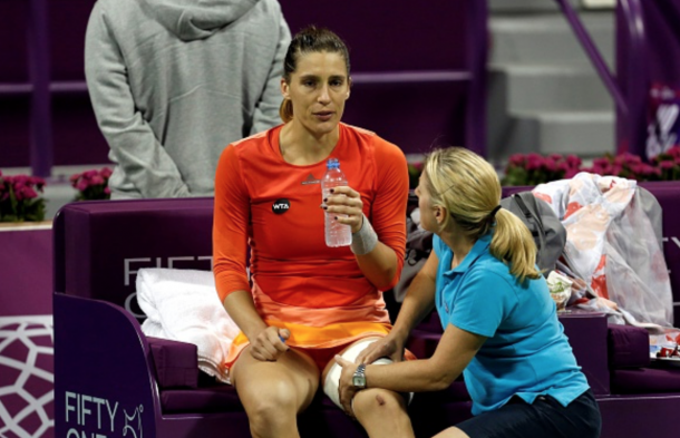 Andrea Petkovic of Germany drinks water during a match against Jelena Ostapenko of Latvia in the women's singles Qatar Open tennis tournament on February 26, 2016 at Khalifa International Tennis and Squash Complex in Doha. (Photo by Mohamed Farag/Anadolu Agency/Getty Images)